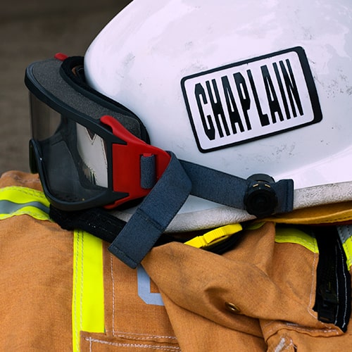 Chaplain's helmet and turnout gear from fire department