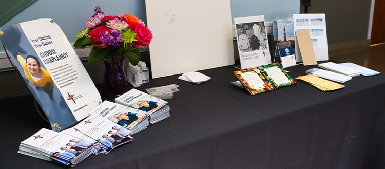 Table full of NACC pamphlets and brochures